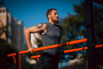 Fototapeta premium Athletic young man maker workout in morning