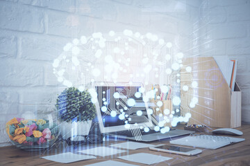 Double exposure of work space with computer and human brain drawing hologram. Brainstorm concept.