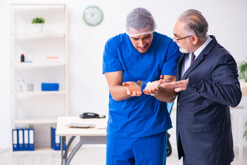 Male doctor in courthouse meeting with advocate