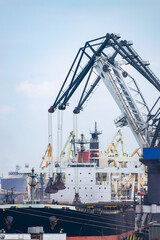 Fototapeta na wymiar Cranes loading ship