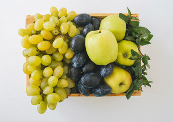 Top view of fresh fruits in wooden box.