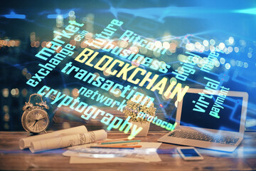 Double exposure of blockchain theme hologram and table with computer background. Concept of bitcoin...