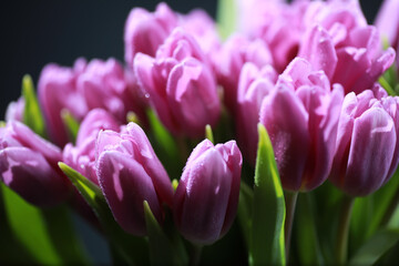 Obraz premium Bouquet of fresh flowers. Holiday gift to your loved one. Background St. Valentine's Day. Rose, tulip, iris flower arrangement.