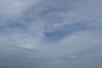 Obraz na płótnie Canvas Blue sky with white clouds over the city