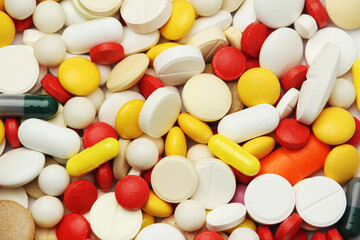 Different colorful tablets at white background