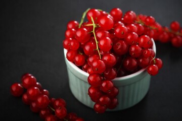 A ceramic bowl with red currant berries