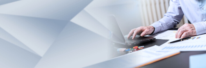 Hands of businessman using laptop, light effect; panoramic banner