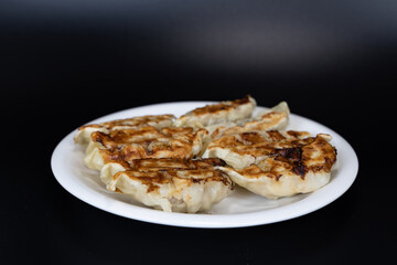 dumpling (Gyoza in Japanese) black background 
