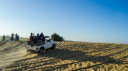Tourists enjoying Jeep safari in Thar desert, Rajasthan © sugitas