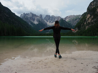 young girl on the mountain lake