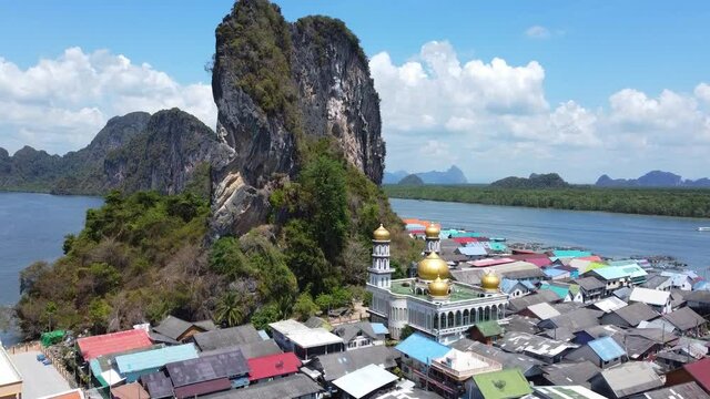 Drone video. flight over tropical islands in the Andaman Sea. muslim mosque on the island. Aerial view of village Ko Panyi island, Thailand.
