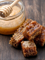 Homemade honeycomb at the wooden background