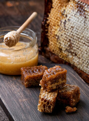 Homemade honeycomb at the wooden background