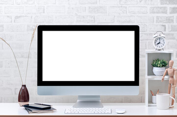Mockup blank screen monitor with keyboard and mouse on white top table in contemporary home office.