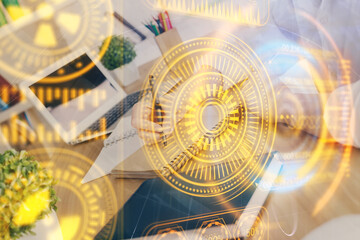 Tech theme hologram over woman's hands taking notes background. Concept of hightech. Double exposure