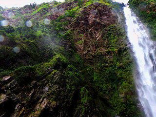 waterfall in the forest with water on camera