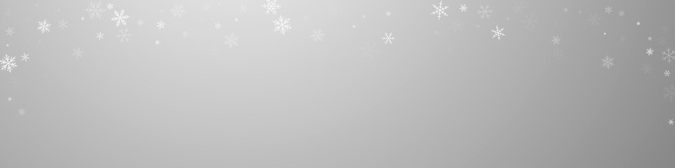 Sparse snowfall Christmas background. Subtle flyin