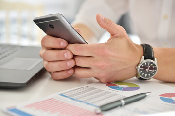 Businessman hand with mobile phone