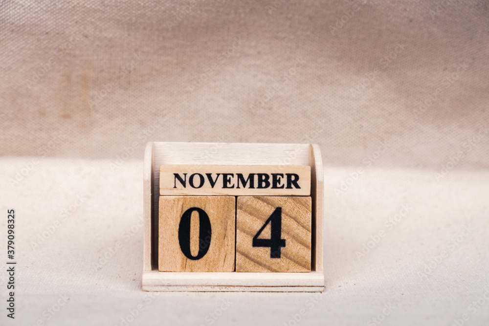 Fototapete november 4th. image of november 4 wooden color calendar on white canvas background. empty space for 