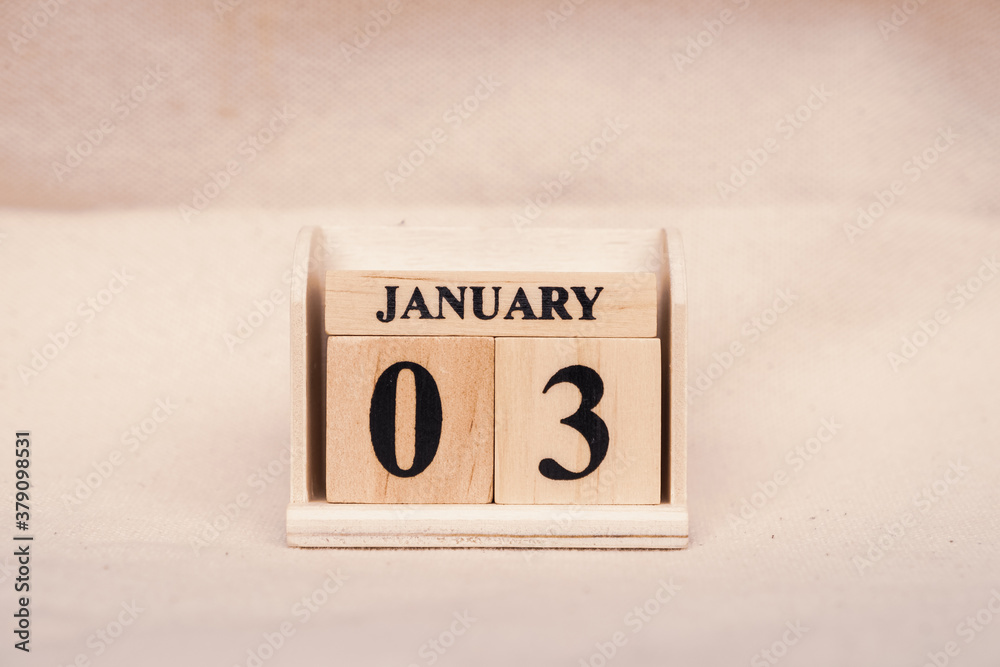 Fototapete january 3rd. image of jan 3 wooden color calendar on white canvas background. empty space for text