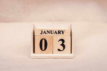 January 3rd. Image of Jan 3 wooden color calendar on white canvas background. empty space for text
