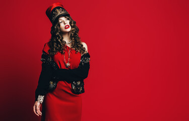 posing hot woman in black jacket and red dress