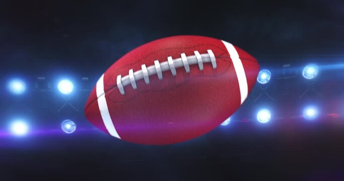 Flying american football ball with flashing stadium spotlights in the night. Rotating sport ball. Sport 4k video background in endless loop.
