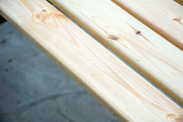 Wood timber stack of pine board. Construction material. Piles of wooden boards in the sawmill, planking. Material for construction on building site