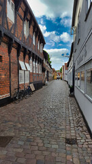 Fototapeta na wymiar Street with old houses in a town in Denmark