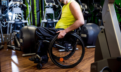 Disabled man training in the gym of rehabilitation center