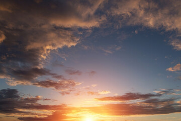 Epic dramatic sunset, sunrise sky with clouds, sun and orange yellow sunlight	