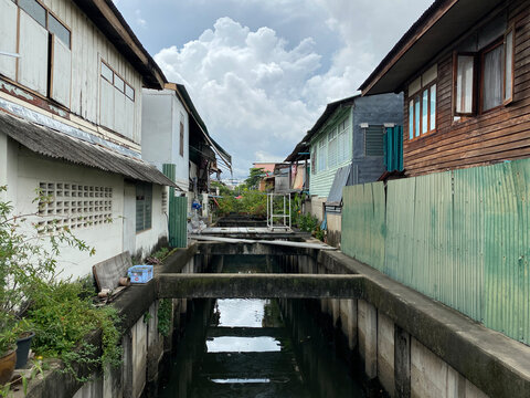 Small cancel passing between houses in Bangkok