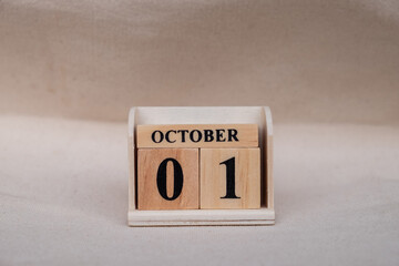 October 1st. Image of October 1 wooden color calendar on white canvas background. empty space for text