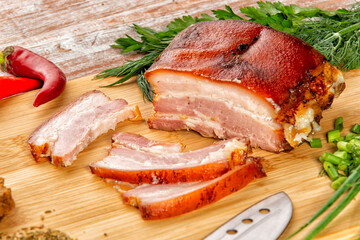 smoked meat lies on the table with herbs and sauce