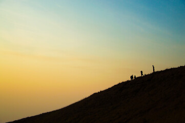 Obraz premium silhouette of a person on a mountain top