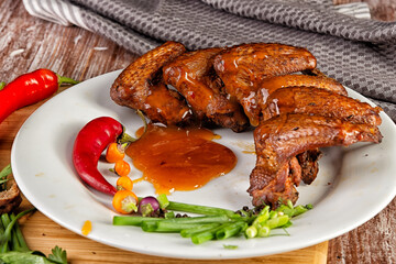 Composition with smoked chicken wings on the table