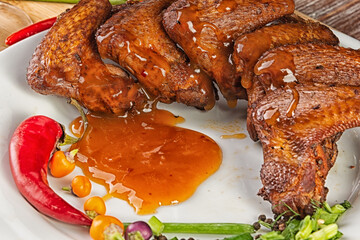 Composition with smoked chicken wings on the table