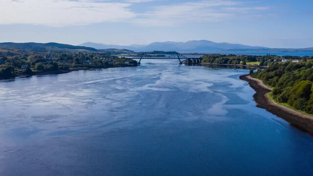 aerial view of the falls of lora near connel, connel bridge and oban in the argyll region of the highlands of scotland during a clear blue autumn day