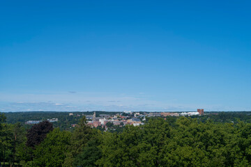 Naklejka premium Cornell University, a private and statutory Ivy League research university in Ithaca, New York, photographed on a clear afternoon from a distance. 