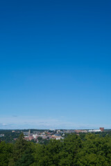 Cornell University, a private and statutory Ivy League research university in Ithaca, New York, photographed on a clear afternoon from a distance. 