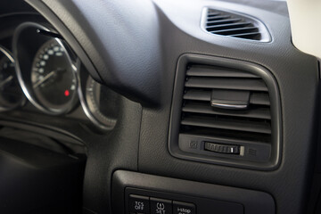 Obraz na płótnie Canvas Air conditioner vent grill in a modern car