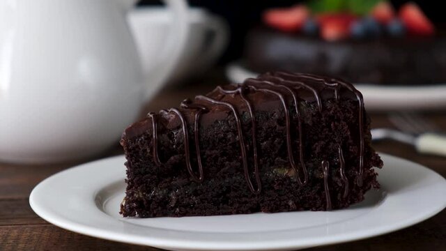 Serving slice of chocolate cake. Delicious moist chocolate cake Zacher or Sacher