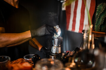 Hand pour coffee from Moka Pot coffee. Coffee shop in Asia.