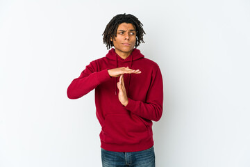 Young african american rasta man showing a timeout gesture.
