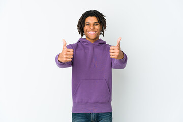 Young african american rasta man smiling and raising thumb up