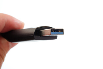 USB 3.0 tumb drive in a woman's hand
