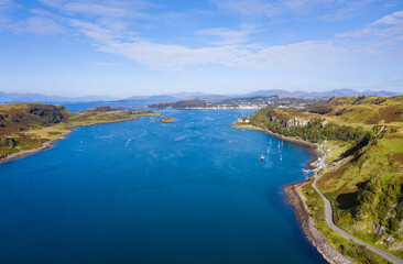 Fototapeta na wymiar aerial view of the sound of kerrera and the island of kerrera near oban in the argyll region of the highlands of scotland during a clear blue calm day in autumn