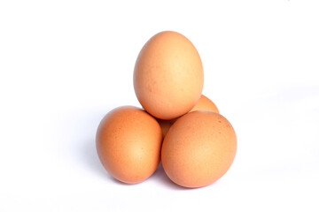 Four chicken eggs isolated on white background
