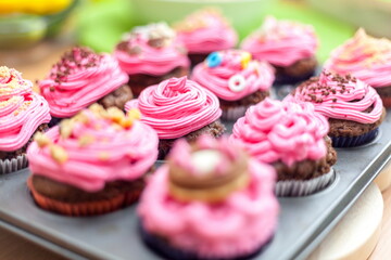 Creative pink cupcakes on plate