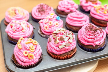 Creative pink cupcakes on plate